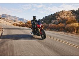 2025-na-imc-indian-101-scout-sunset-red-metallic-riding-front-copy